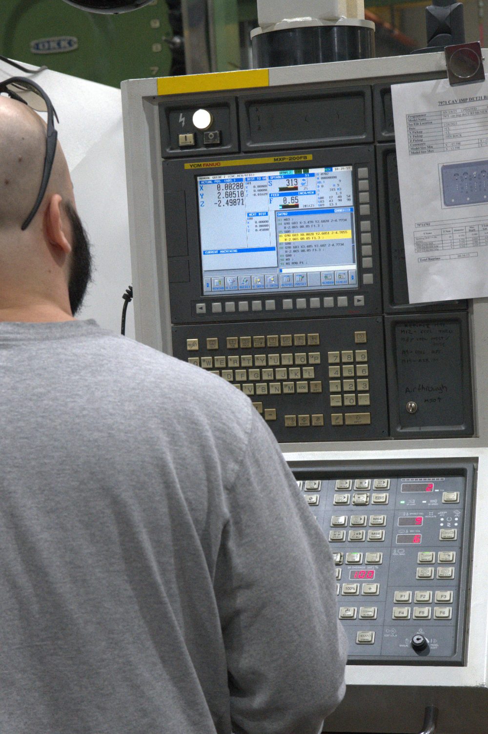 Elba machinist at the CNC control panel
